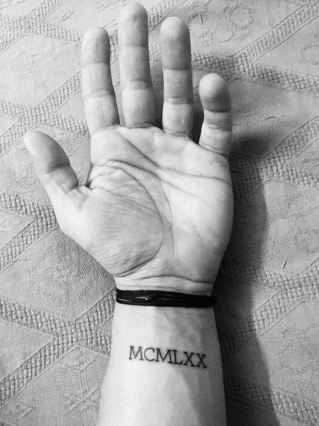 Picture of: tattoo #wrist #ideas #numerals #mcmlxx # #smalltattoo
